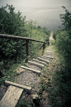 steps leading to a lake shore 