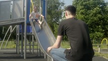 Father plays in the park with children (120fps)

