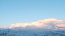 Clouds time lapse over snowy landscape