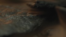 Rough abstract wet stones rotating with a foggy atmosphere around them 