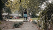 mother trick-or-treating with her toddler daughter 