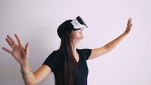 a woman using VR glasses 