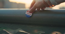 An ‘I Voted Today’ Sticker being placed on a guardrail