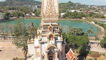 Pagoda tower of Wat Chalong in Mueang District, in Phuket, Thailand - Aerial tracking Orbit medium shot	