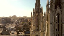 Fly-through Antwerp Saint George's church Towers Revealing cityscape, Belgium - Aerial rotation ascending shot