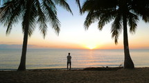 man enjoying the sunset on a Caribbean beach 