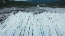 Flying Low Over Massive Chunks Of Ice In A Glacier	