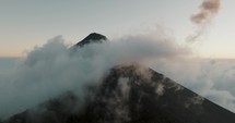 Fuego Volcano Covered In Clouds In Guatemala - aerial drone shot	