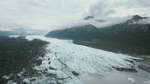Massive Glacier On A Cloudy Day In The Mountains	