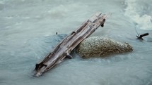 Driftwood And Rocks In A River