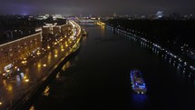 Aerial view of night Moscow with river and bridge, Russia