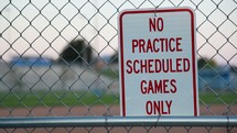 game field sign on a fence 