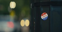 An ‘I Voted Today’ Sticker being placed on a guardrail