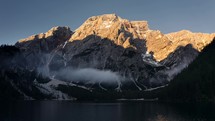 Misty cloud over Lago di Braies Italy during sunrise