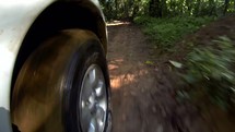 wheel driving on dirt road 