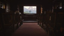 Old Wood Chapel Pews with Cross and Mountain View