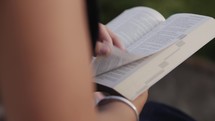 Women reading bible outdoors