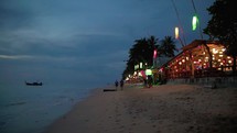 illuminated bar at night in thailand with lanterns