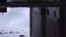 Raindrops in the puddle in slow motion