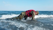 Miltary marine american man training push up in the ocean