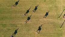 Argentina October 2023: Top down Drone aerial shot of Polo horse player ride a horse In Games. Dramatic shadows at the ground
