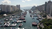 Hong Kong harbour in Aberdeen drone view. Boats, ferries and yachts. A popular tourism destination in Asia.