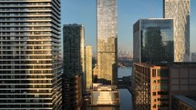 Bright Golden Sun Shining Through Buildings in London at Sunrise