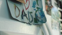 a child's father's day artwork on a refrigerator 