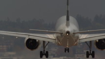 View from behind of a commercial airplane landing. 