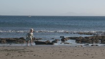 Little girl running at the seaside