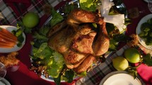 Turkey Placed At Center Of Table For Thanksgiving Day Dinner, vertical