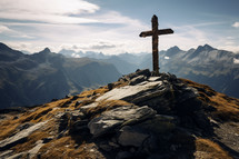An Old Mossy Cross at the top of a beautiful mountain