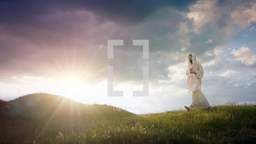 Christ as the Eternal Pilgrim descending a hill at sunrise.
