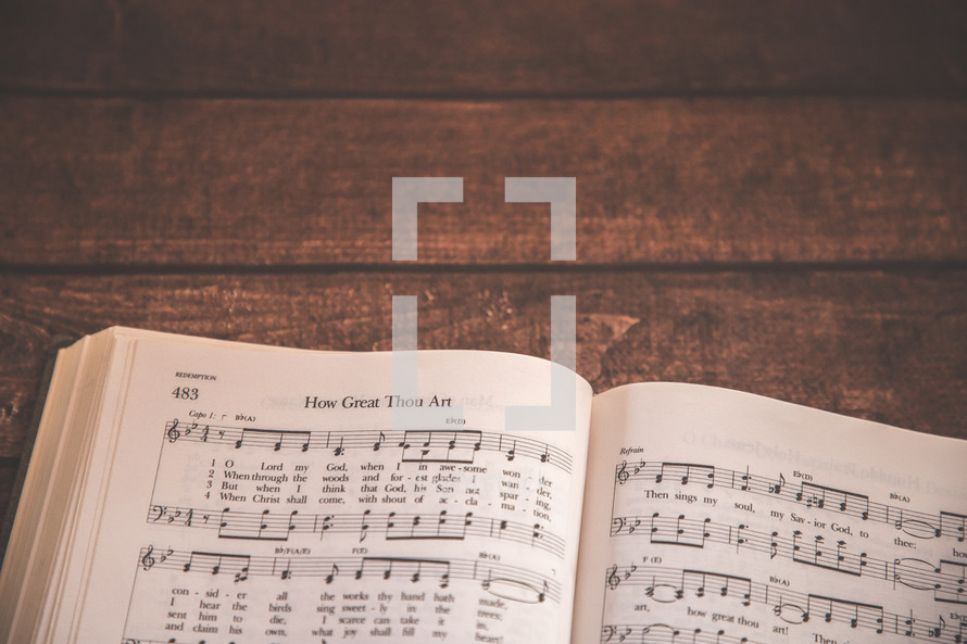 Hymnal opened to How Great Thou Art 