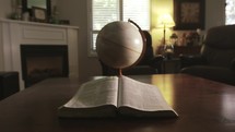 Bible and spinning globe 