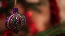Christmas decorations rotating on blinking bokeh background.
