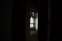stained glass window in darkness 