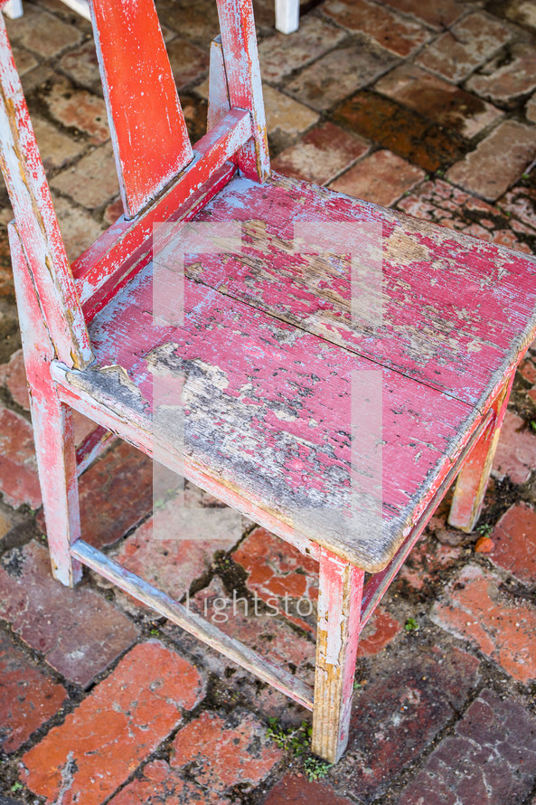 old weathered red chair 