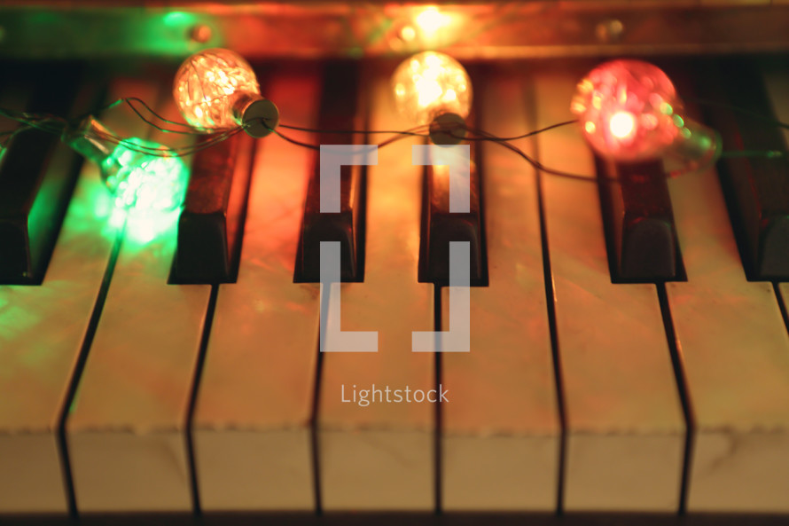retro coloured lights illuminate a vintage piano