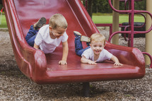 brothers on a slide 