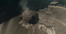 Ash from Fuego volcano eruption in Guatemala. Aerial top down orbit	