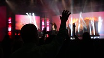 waving hands raised in worship 