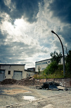 pile of rubble in front of an old warehouse 