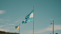 Flags Of Argentina And Tierra del Fuego Waving With The Wind In Patagonia. slow motion