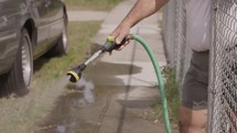 watering the grass with a hose 