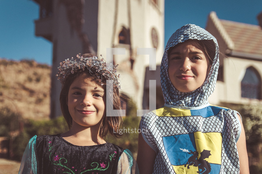 children dressed up like a knight and princess