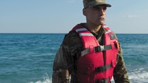 Military marine american man training swim in winter cold water