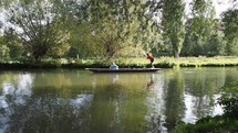 CAMBRIDGE, UK - CIRCA OCTOBER 2018: Punting on River Cam - EDITORIAL USE ONLY