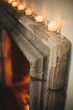 votive candles at the top of a doorway