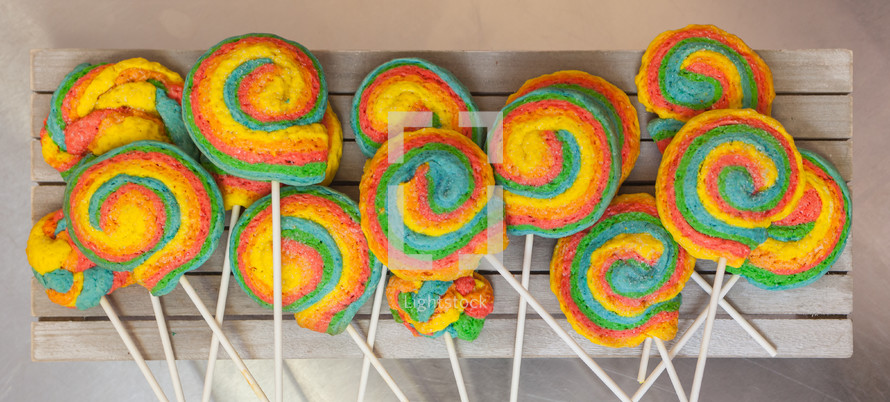 Pinwheels Lollypop for Carnival. Colored shortbread cakes.